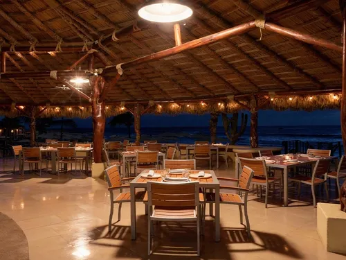 Outdoor dining area at El Canto de las Sirenas restaurant at Hacienda Del Mar Los Cabos - Redesign in Cabo San Lucas.