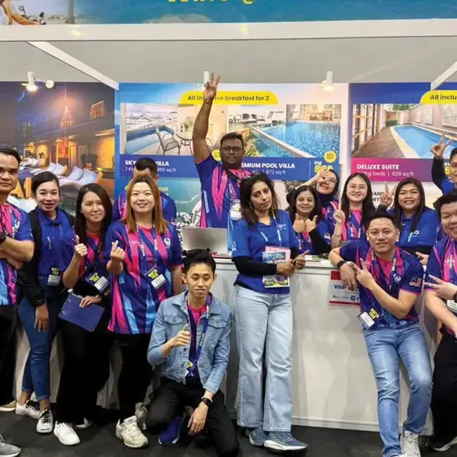 Lexis Hotel Group staff posing for a photo at Matta Fair - Lexis Hotel Group