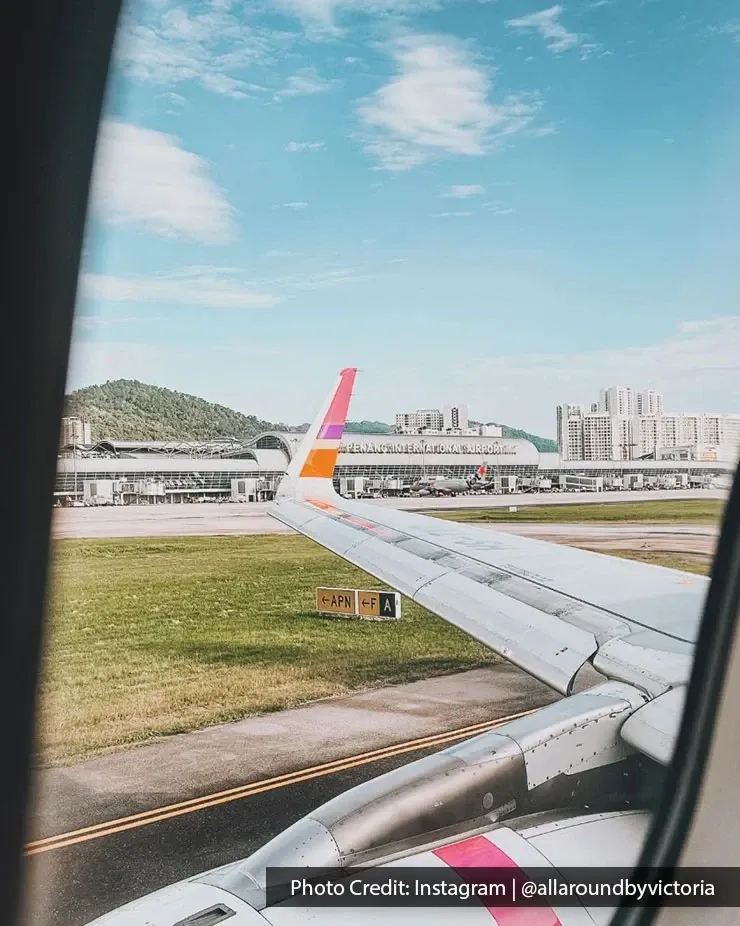 Plane preparing for departure at Penang International Airport seen from window seat