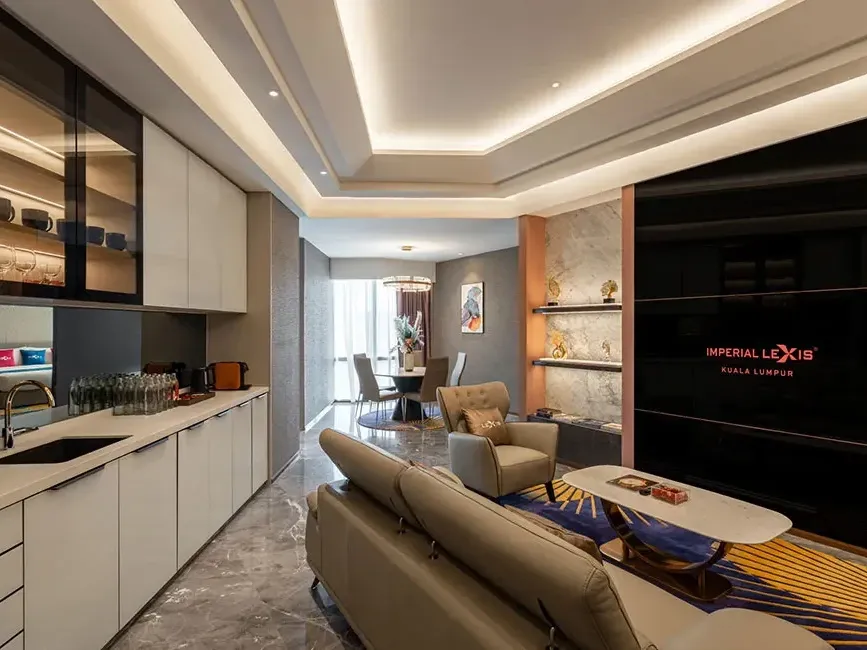 Modern kitchenette and open-plan living area in the Royal Penthouse Suite at Imperial Lexis KL.