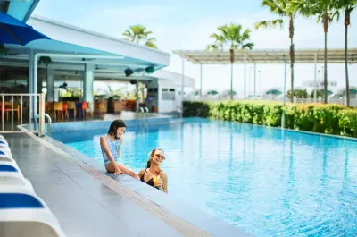 Family enjoying outdoor swiming pool - Lexis Hibiscus Port Dickson