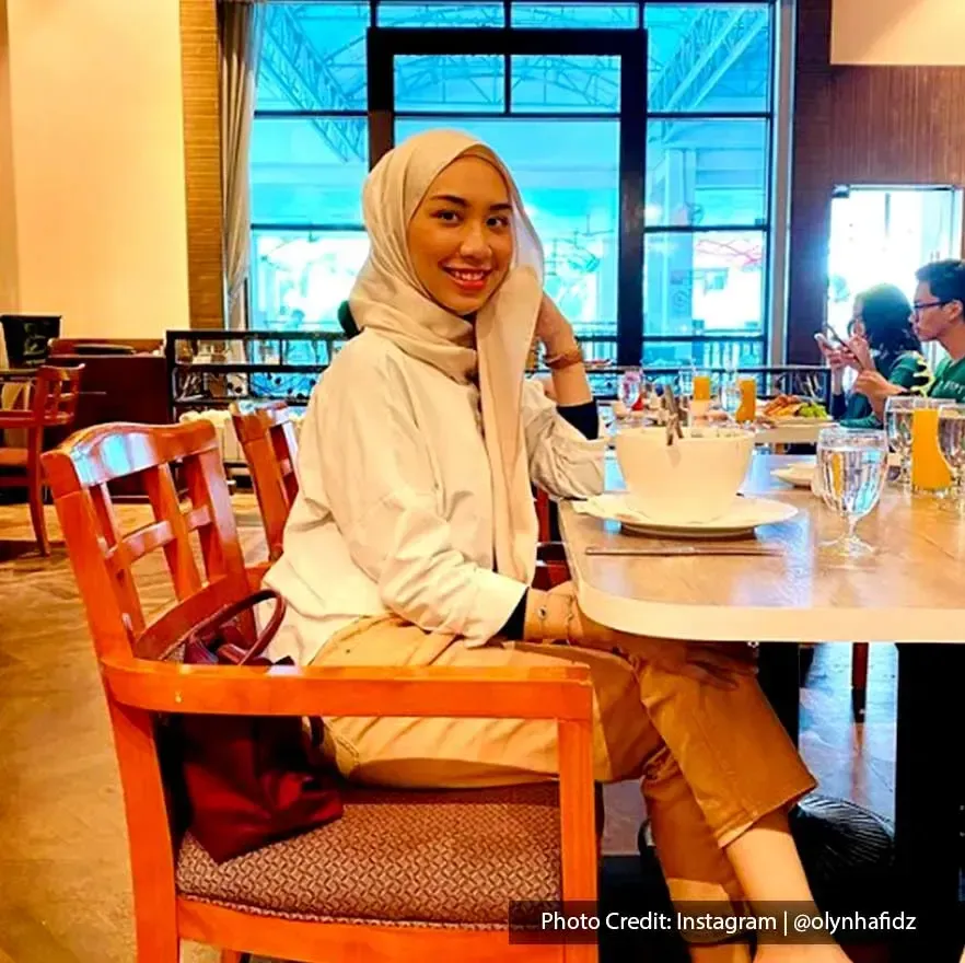 A lady is enjoying her meal at Grand Lexis PD