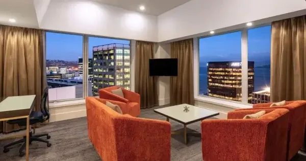 Spacious lounge with harbour views at James Cook Hotel Grand Chancellor Wellington