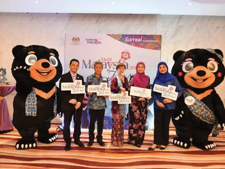 Representatives from Tourism Malaysia posing for a photo outside of Hibiscus Grand Ballroom at Lexis Hibiscus Port Dickson - Lexis Hotels & Resorts