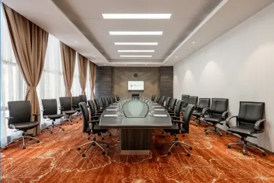 Conference room with large table and office chairs – Lexis Hibiscus Port Dickson