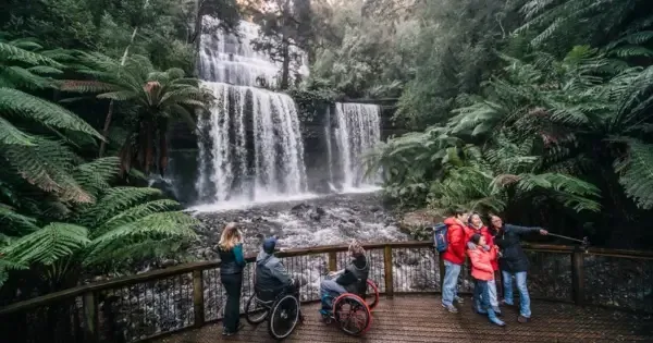 Accessible viewing platform at Russell Falls in Mount Field National Park, with visitors enjoying the waterfal