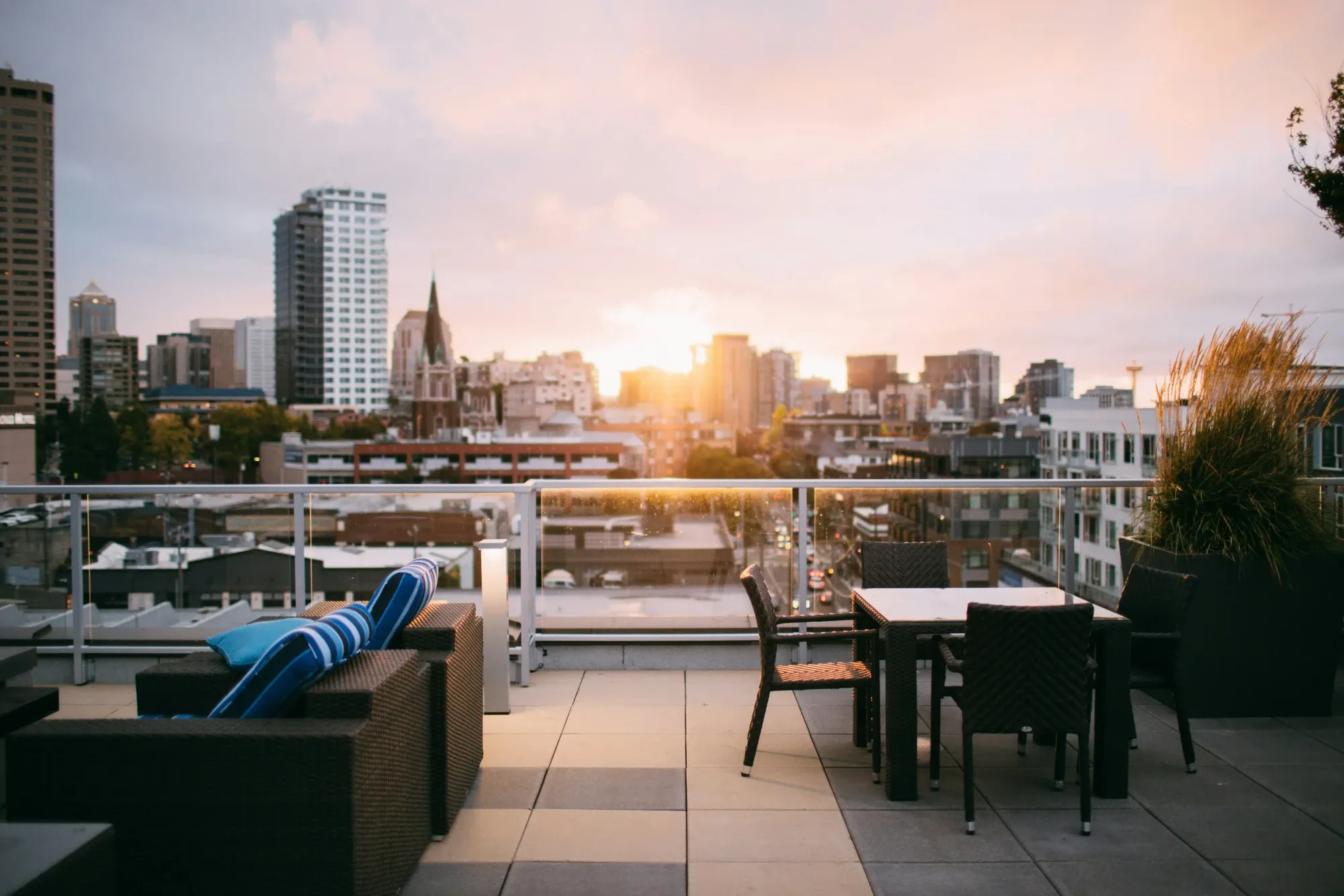 Sunset on rooftop overlooking city
