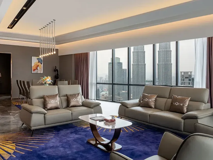Ultra-luxury living room in the Presidential Pool Suite with panoramic Petronas Twin Towers views.