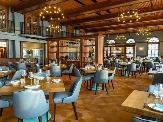 Elegant main dining room at Klaw Miami with views of Biscayne Bay and luxe decor.