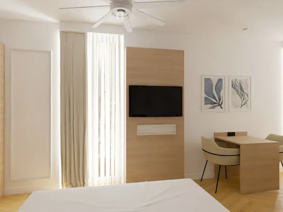 Chambre luxueuse avec bureau et télévision à Les Sources Callou à Vichy.