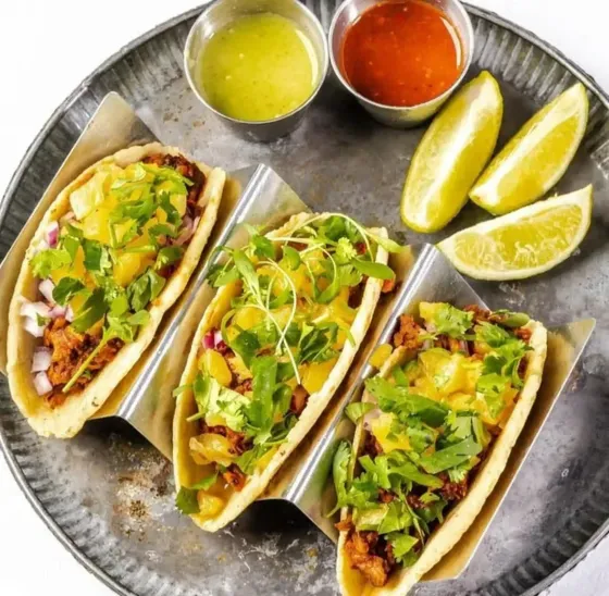     Tacos with fresh cilantro, onion and lime at Uptown 66 Taqueria in Miami’s MiMo District