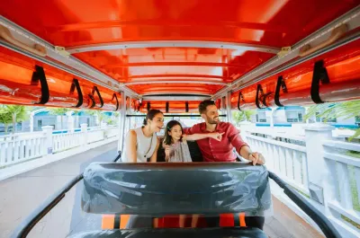 Family taking a shuttle ride around the resort - Lexis Hibiscus Port Dickson