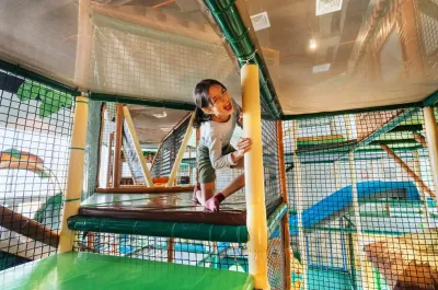 Child at Kidz World is exploring the indoor playground - Lexis Hibiscus Port Dickson