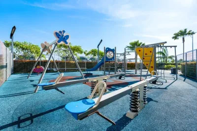 Children's playground with swings and seesaw – Lexis Hibiscus Port Dickson