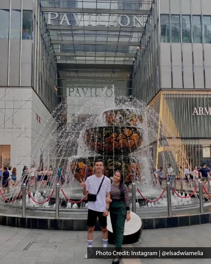 Shoppers posing near the Pavilion Kuala Lumpur fountain entrance in Bukit Bintang