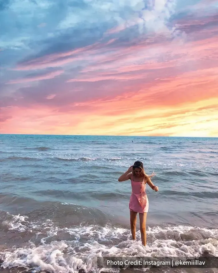 beautiful view of beach with vibrant sky and waves