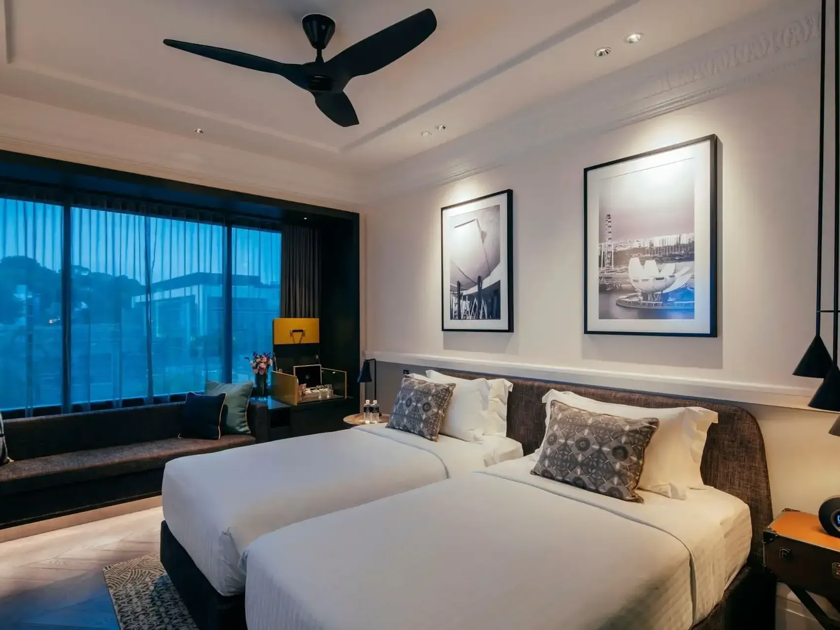 Couch and nightstands by the beds in Deluxe Room at Grand Park City Hall