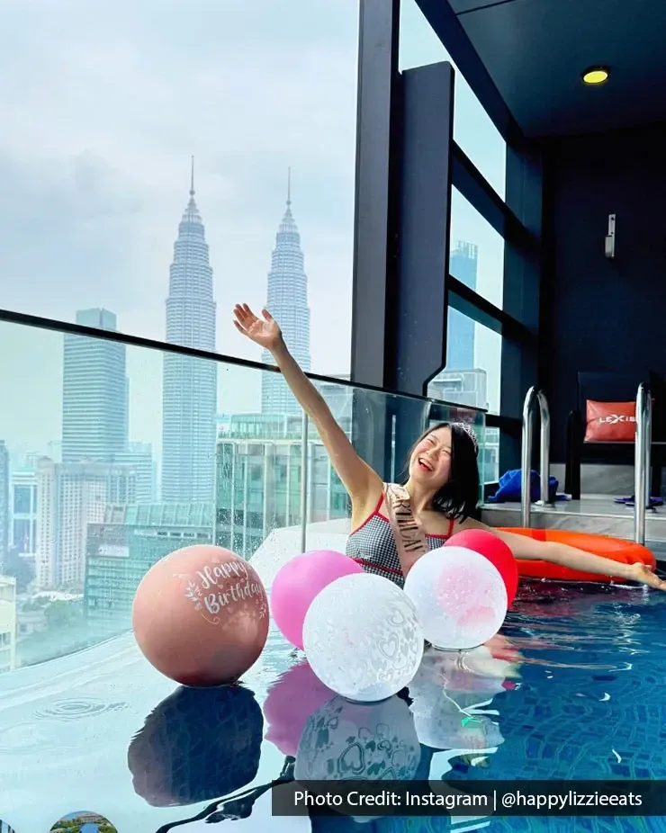 Woman celebrate birthday in a private pool at a hotel in kuala lumpur with KLCC views.