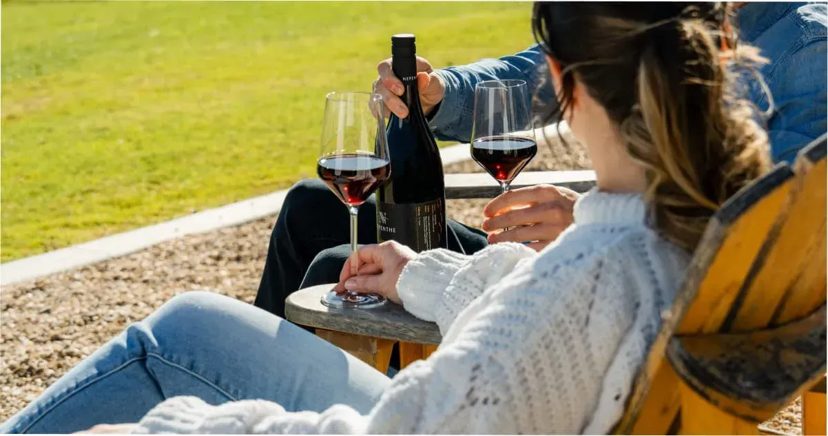 A couple enjoying a glass of wine at an Adelaide Hills winery