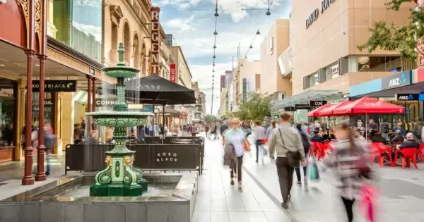 People walking past green Rundle Mall Fountain in Adelaide’s city centre