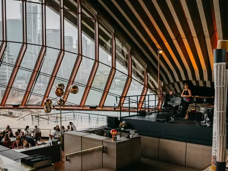Interior of the Sydney Opera House with a live band performing near Pullman Quay Grand Sydney