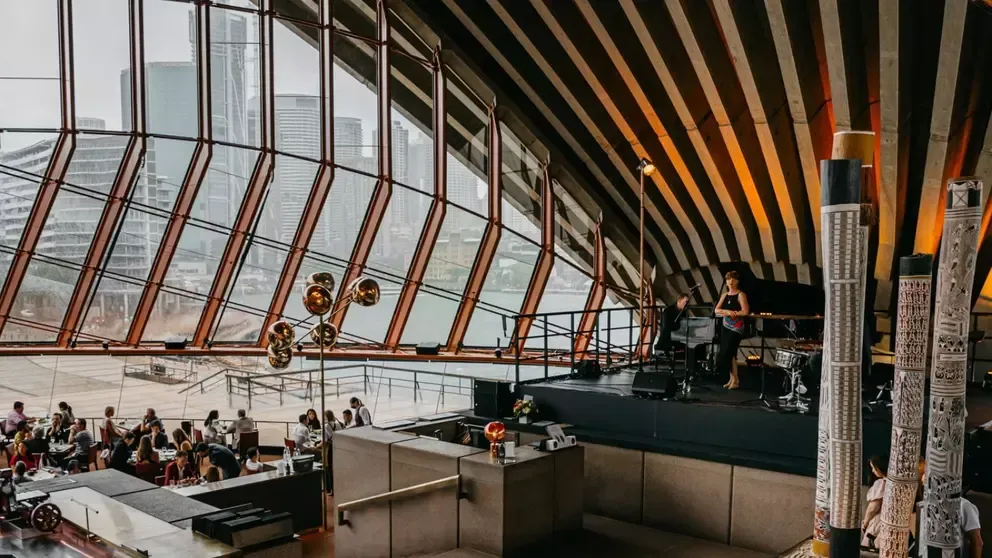 Interior of the Sydney Opera House with a live band performing near Pullman Quay Grand Sydney