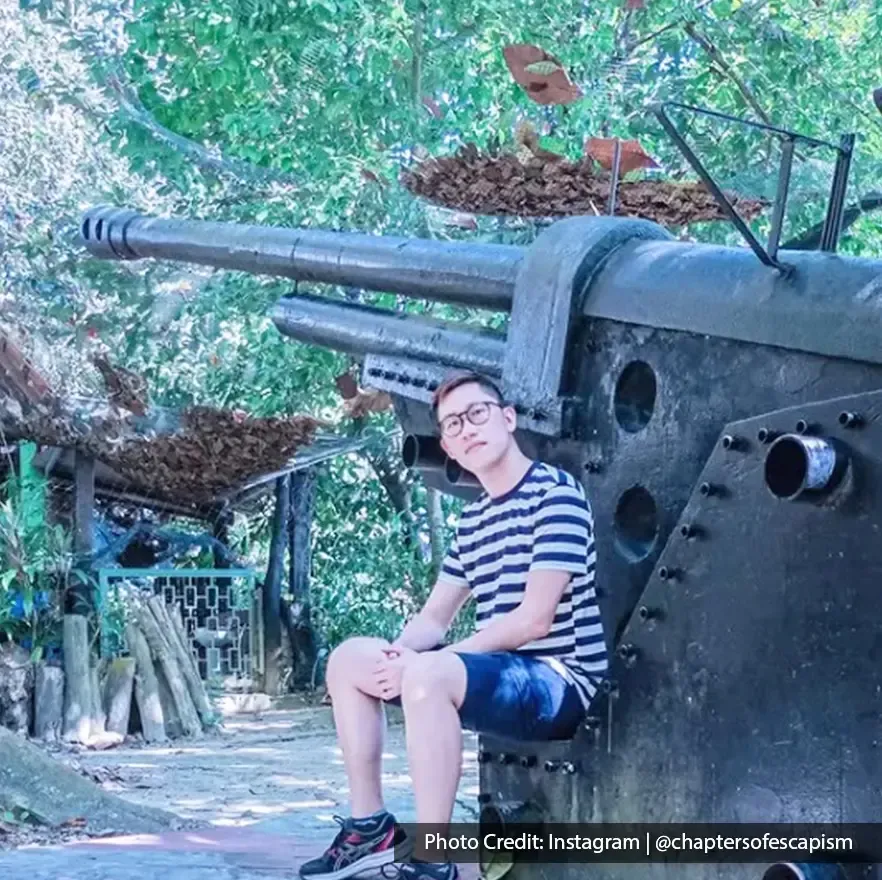 Man posing next to historic war cannon at Penang War Museum – Lexis Suites Penang