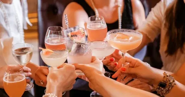 Colleagues raising glasses at a festive end-of-year work party