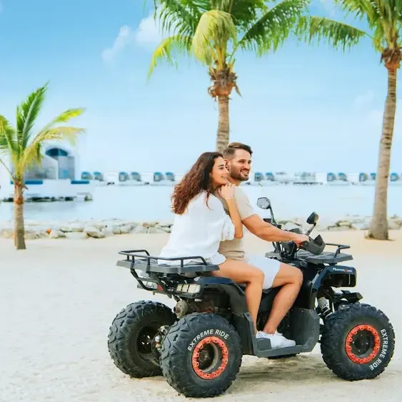 Couple enjoying an ATV ride by the beach at Lexis Hibiscus Port Dickson - Lexis Hotels & Resorts
