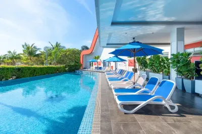 Outdoor swimming pool with clear blue water – Lexis Hibiscus Port Dickson