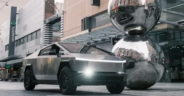 tesla parked next to The Spheres at rundle mall adelaide
