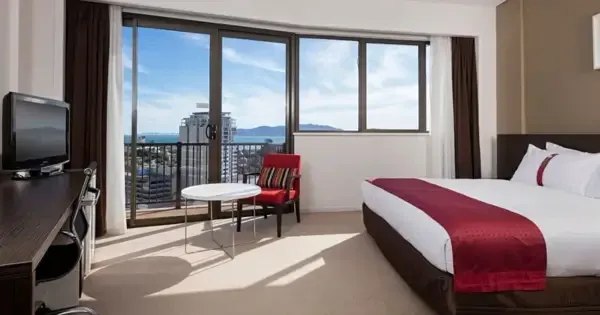 Executive king suite with balcony overlooking ocean skyline at Hotel Grand Chancellor Townsville 