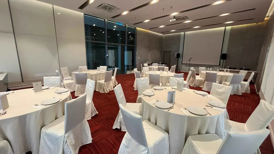 Function Hall - Round table set-up with digital screen in a meeting room at Sunway Velocity Hotel