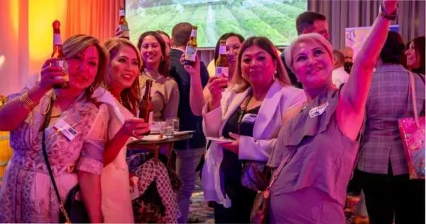  A group of women smiling at the camera during an event at The Hotel Grand Chancellor in Adelaide