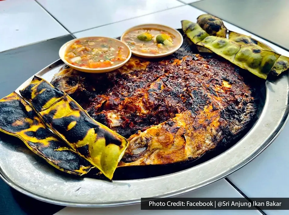 Grilled fish with spicy sambal and petai served at Ikan Bakar Sri Anjung
