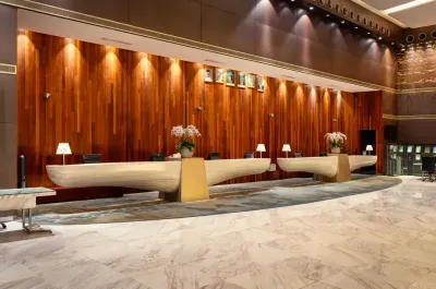 Modern hotel front desk with warm lighting – Lexis Hibiscus Port Dickson