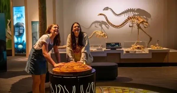 Teenage girls interact with an exhibit at Te Papa museum