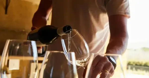 Cellar door staff pours Tamar Valley white wine varietals for a tasting