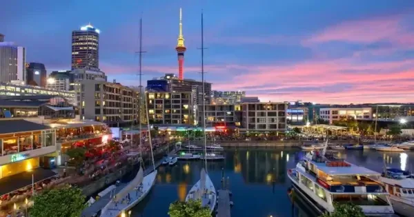 The Chancellor on Hobson at night with Auckland SkyTower in background