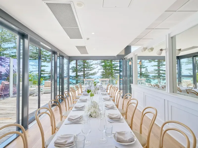 Long white dining table at Elysium Manly under a vaulted ceiling floor in Cibaria\'s Terrazza, perfect for Manly event venues