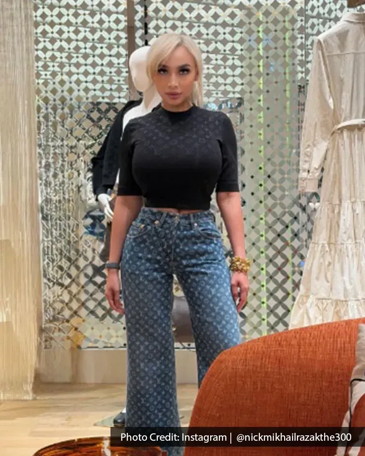 Shopper poses in luxury fashion inside Pavilion Kuala Lumpur shopping mall