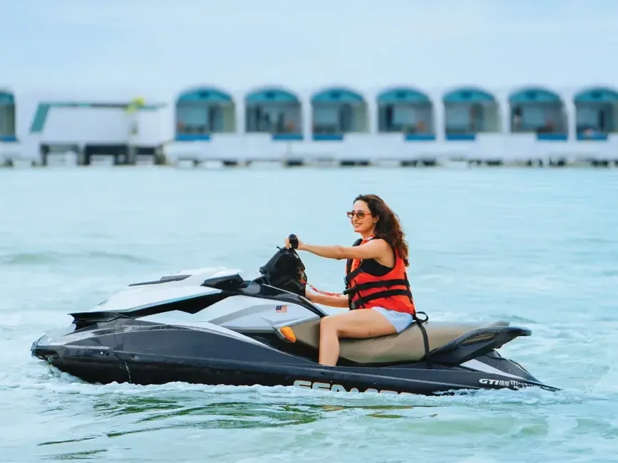 A woman enjoying the jet ski ride at Lexis Hibiscus Port Dickson - Lexis Hotels & Resorts