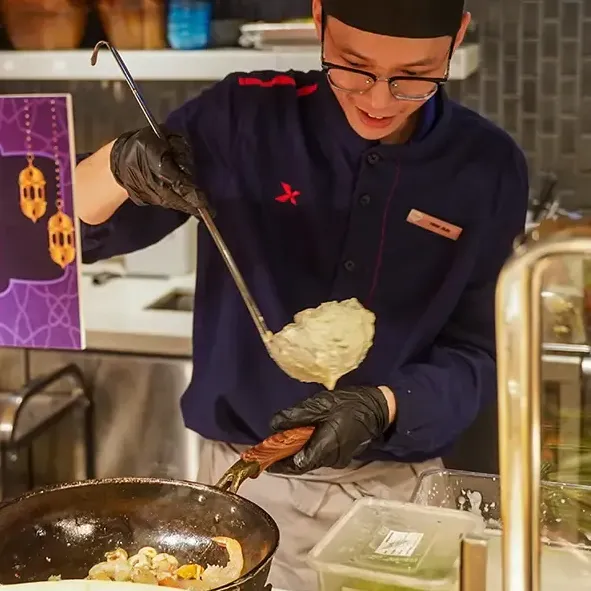 A chef cooking a Ramadan dish at Roselle Coffee House, Imperial Lexis Kuala Lumpur - Lexis Hotels & Resorts