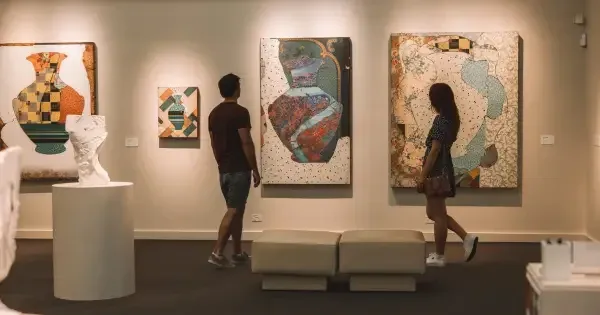A couple observing art at  Perc Tucker Regional Gallery, Townsville.