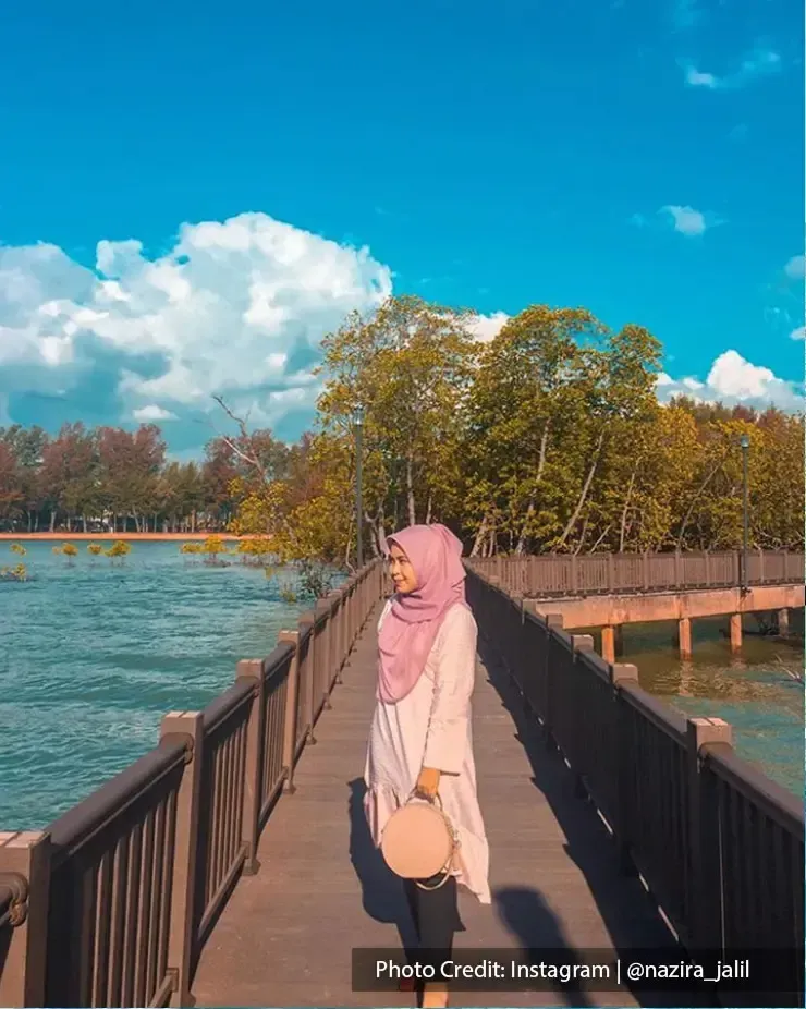 Girl posing on a bridge at Pantai Cahaya Negeri, Port Dickson