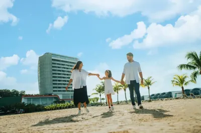 Family enjoying a walk on the beach - Lexis Hibiscus Port Dickson