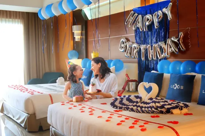 A woman and a child celebrating birthday surrounded by colourful decorations - Lexis Hibiscus Port Dickson