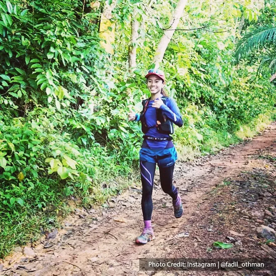 girl jogging on forest trail