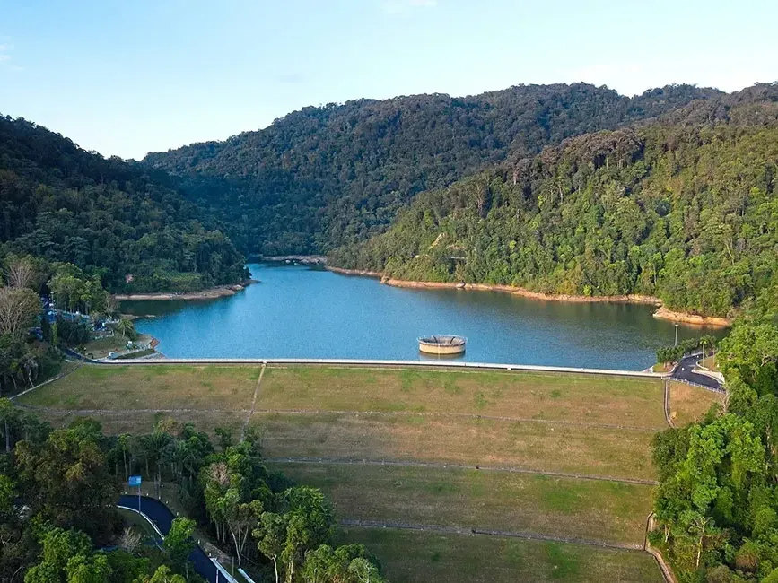 Aerial view of Air Itam Dam encircled by vibrant green trees - Lexis Suites Penang