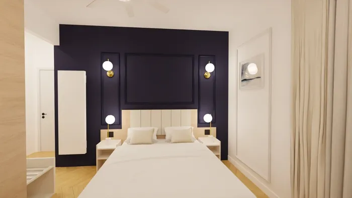 Chambre élégante avec lit double, murs violets et éclairage moderne à Les Sources Callou.